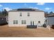 Backyard view featuring a patio, lawn, and solar panels on the roof of the house at 2527 Dayview Ln, Atlanta, GA 30331