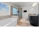 Bathroom with a bathtub, glass shower, tiled walls, and dark wood vanity at 2527 Dayview Ln, Atlanta, GA 30331