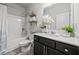 Clean bathroom showcasing tub, shower, vanity, and elegant décor at 2527 Dayview Ln, Atlanta, GA 30331