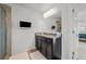 Bathroom with a shower, granite countertop vanity, and a wall-mounted TV at 2527 Dayview Ln, Atlanta, GA 30331