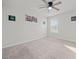 Neutral room with soft carpet, ceiling fan, and a window letting in natural light at 2527 Dayview Ln, Atlanta, GA 30331