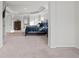 Bright bedroom featuring neutral walls, plush carpeting, dark wood bed, and tray ceiling at 2527 Dayview Ln, Atlanta, GA 30331