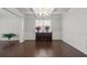Dining room featuring coffered ceilings, wainscoting and beautiful hardwood flooring at 2527 Dayview Ln, Atlanta, GA 30331