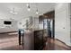 Modern kitchen featuring a granite island with seating and access to the living room at 2527 Dayview Ln, Atlanta, GA 30331