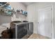 Functional laundry room with modern washer and dryer appliances at 2527 Dayview Ln, Atlanta, GA 30331