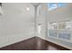 Spacious living room featuring high ceilings, modern lighting, and decorative wall trim at 2527 Dayview Ln, Atlanta, GA 30331