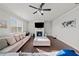 Bright living room features a fireplace, large couch, and ceiling fan at 2527 Dayview Ln, Atlanta, GA 30331