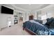 Stylish main bedroom features tray ceiling, plush carpet, and modern TV at 2527 Dayview Ln, Atlanta, GA 30331