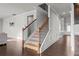 Staircase with hardwood flooring and iron railings at 2527 Dayview Ln, Atlanta, GA 30331