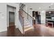 Staircase with hardwood flooring and iron railings at 2527 Dayview Ln, Atlanta, GA 30331