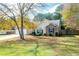 Two-story house with stone accents, a two-car garage, and a spacious yard at 117 Javay Ct, Villa Rica, GA 30180