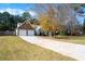 This home features a long driveway leading to a two-car garage and a stone facade at 117 Javay Ct, Villa Rica, GA 30180