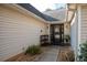 Inviting front entry with a black door, stone walkway, and landscaping at 117 Javay Ct, Villa Rica, GA 30180