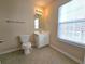 Small bathroom featuring tile floors, a toilet, a vanity with mirror, and natural light at 2192 Landing Walk Dr, Duluth, GA 30097