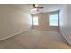 Spacious bedroom filled with natural light, featuring a ceiling fan and plush carpeting for comfort at 2192 Landing Walk Dr, Duluth, GA 30097