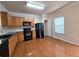 Kitchen featuring wooden cabinets, black appliances and tile backsplash at 2192 Landing Walk Dr, Duluth, GA 30097