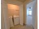 Convenient laundry closet with washer and dryer, located near the bedroom, offering practicality at 2192 Landing Walk Dr, Duluth, GA 30097