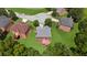 Aerial view of the home showcasing the roof, backyard, and surrounding neighborhood at 6519 Cheval Ct, Stone Mountain, GA 30087