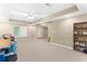 Spacious finished basement with neutral carpeting and ample storage at 6519 Cheval Ct, Stone Mountain, GA 30087