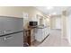 Basement kitchenette with refrigerator, microwave, sink and ample counter space at 6519 Cheval Ct, Stone Mountain, GA 30087