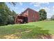 Brick house with a large deck and spacious backyard at 6519 Cheval Ct, Stone Mountain, GA 30087