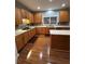 Kitchen area featuring oak cabinets, stainless steel appliances, and white countertops at 6519 Cheval Ct, Stone Mountain, GA 30087