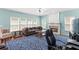 Living room with fireplace, hardwood floors, and large windows at 6519 Cheval Ct, Stone Mountain, GA 30087