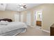 Spacious main bedroom with a comfortable bed, attached bathroom, and natural lighting at 6519 Cheval Ct, Stone Mountain, GA 30087