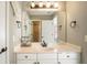 Bright bathroom with white vanity and a large mirror at 6610 Wesley Trail Holw, Cumming, GA 30028