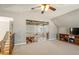 Spacious bonus room with a view of the main level and built-in shelving at 6610 Wesley Trail Holw, Cumming, GA 30028