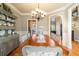 Formal dining room with hardwood floors, chandelier, and built-in hutch at 6610 Wesley Trail Holw, Cumming, GA 30028