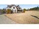 Two-story house with stone and shingle accents, and a wrap-around porch at 6610 Wesley Trail Holw, Cumming, GA 30028