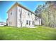 Well-maintained home with a patio and grassy backyard at 11988 Lovejoy Crossing Pl, Hampton, GA 30228