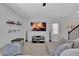 Living room with a cozy atmosphere and a fireplace displayed on TV at 11988 Lovejoy Crossing Pl, Hampton, GA 30228