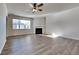Bright living room with hardwood floors, fireplace, and large windows at 2810 Torunn Ct, Atlanta, GA 30331