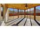 Spacious screened porch with ceiling fan and tile flooring at 2810 Torunn Ct, Atlanta, GA 30331