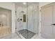 Spa-like bathroom with a large walk-in shower and marble tile at 4265 Haynes Cir, Snellville, GA 30039