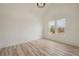 Bright bedroom with two windows, light wood flooring and vaulted ceiling at 4265 Haynes Cir, Snellville, GA 30039