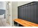 Built-in bench with storage and hooks in a mudroom area at 4265 Haynes Cir, Snellville, GA 30039