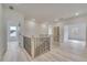 Upstairs hallway with light wood floors and access to bedrooms at 4265 Haynes Cir, Snellville, GA 30039