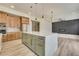 Open concept kitchen with large island and view into Gathering room at 4265 Haynes Cir, Snellville, GA 30039