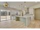 Modern kitchen with white and wood cabinets, quartz countertops, and herringbone backsplash at 4265 Haynes Cir, Snellville, GA 30039