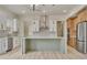 Open concept kitchen with an island and stainless steel appliances at 4265 Haynes Cir, Snellville, GA 30039