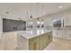 Open concept kitchen with large island and view into living room at 4265 Haynes Cir, Snellville, GA 30039