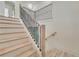 Elegant staircase with wrought iron railings leading to the second floor at 4265 Haynes Cir, Snellville, GA 30039