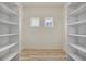 Bright walk-in closet with ample shelving and hanging space at 4265 Haynes Cir, Snellville, GA 30039
