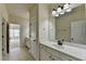 Well-lit bathroom featuring double vanity, sleek fixtures, and tile flooring at 4610 Point Rock Dr, Buford, GA 30519