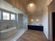 Spa-like bathroom with marble, soaking tub, walk-in shower, and blue vanity at 210 Carl Sanders Dr, Acworth, GA 30101