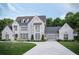 Two-story home with white brick, gray roof, and landscaping at 210 Carl Sanders Dr, Acworth, GA 30101