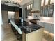 Elegant kitchen with large island and black marble countertops at 210 Carl Sanders Dr, Acworth, GA 30101